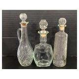 Cut and clear glass decanter trio