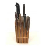 Wooden butchers block of assorted kitchen knives
