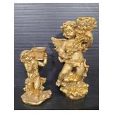 Pair of resin cherub candlesticks