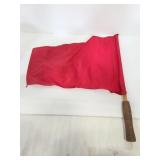 Red flag with wood handle