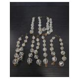 Eleven cut crystal ball strands w/ crosses on ends