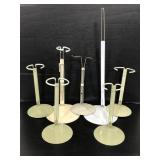 Seven assorted metal doll stands