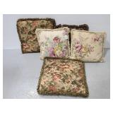 Five floral decorative throw pillows