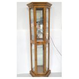 Lighted curio cabinet with glass shelves