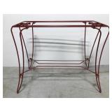 Large red painted metal table stand