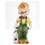 Ceramic boy and dog figurine