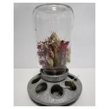 Chick feeder w/ dried flowers in glass jar