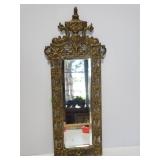 Ornate brass framed mirror