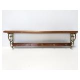 Wood and brass shelf with hooks