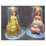 2 vintage dolls in domes