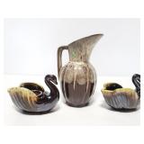 Small pottery pitcher and swan candleholders