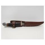 Knife in leather sheath