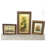 Three framed floral paintings