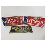 Three vintage Michigan license plates