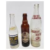 Old vintage glass beverage bottle trio