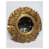 Gold toned grape theme framed round mirror