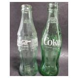 Glass CocaCola bottle pair
