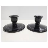 Pair of black glass candlestick holders