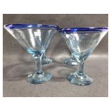 Four blue rim martini glasses