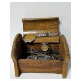 Old car emblems in wooden box