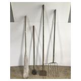 Four old yard tools w/ wooden boat paddle