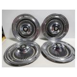 Four Buick Wildcat hubcaps