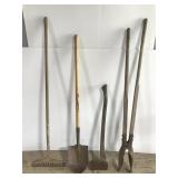 Four landscaping tools- shovel, rake, ax, digger