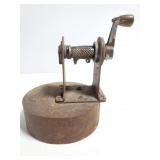 Old pencil sharpener on heavy weighted base