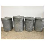 Four galvanized metal trash cans w/ lids