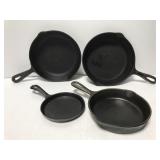 Four cast iron skillets