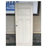 Old heavy white painted wood door