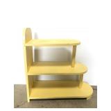 Yellow painted wood peninsula shelf