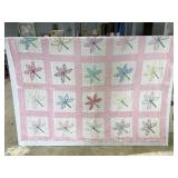 Hand stitched twin size floral pattern quilt