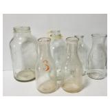 Six vintage milk bottles and jars