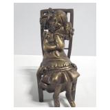 Brass girl on a chair figurine