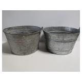 Two galvanized metal buckets