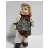 Vintage porcelain doll on stand