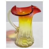 Small yellow and red glass pitcher