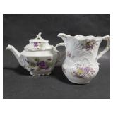 Small porcelain teapot and pitcher