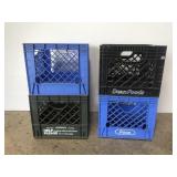 Four genuine plastic milk crates