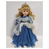 Porcelain doll on stand