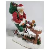 Santa on a bike statue