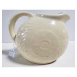 Antique cream colored ceramic pitcher