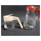 Pair of vintage syrup pourers