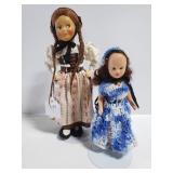 Pair of vintage dolls on stands