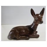 Painted concrete deer statue
