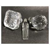 Three glass stoppers