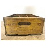 Old yellow wooden Coca Cola bottle crate