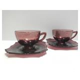 Amethyst glass teacup and saucer pair