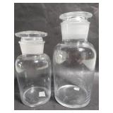 Pair of clear glass lidded jars